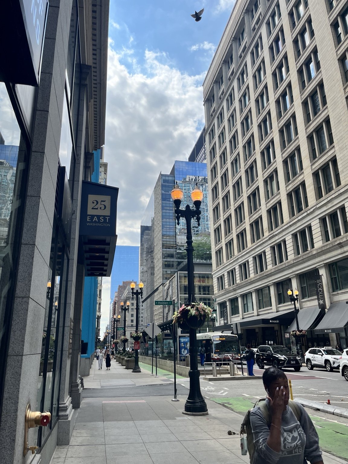 A sunny Chicago street with tall buildings
